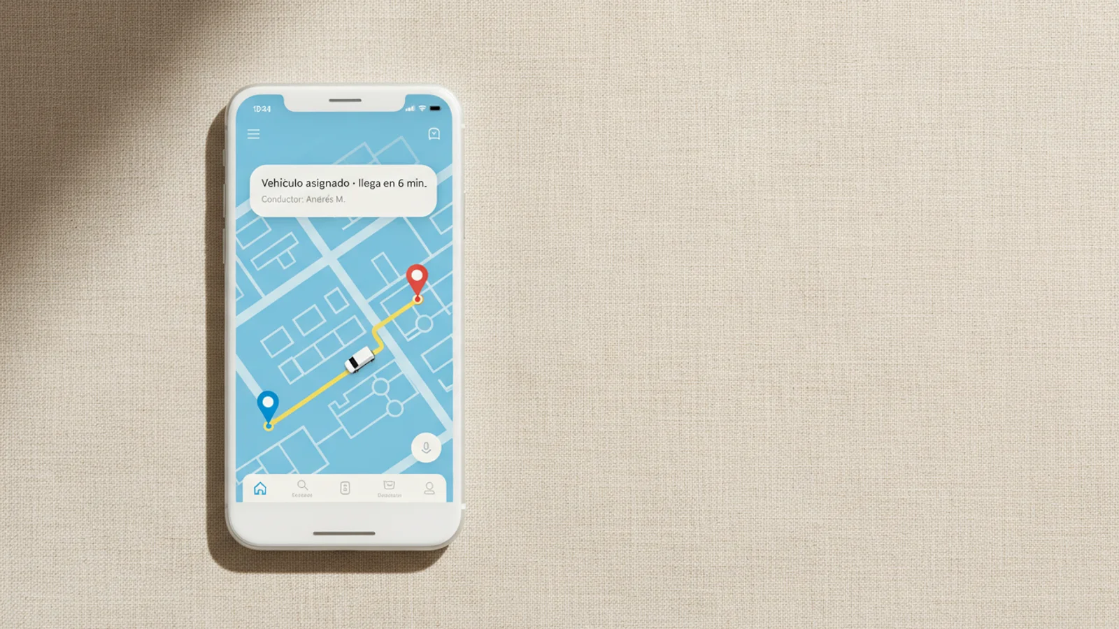 Smartphone sobre lino crema mostrando mapa con ruta amarilla y notificación de vehículo asignado.
